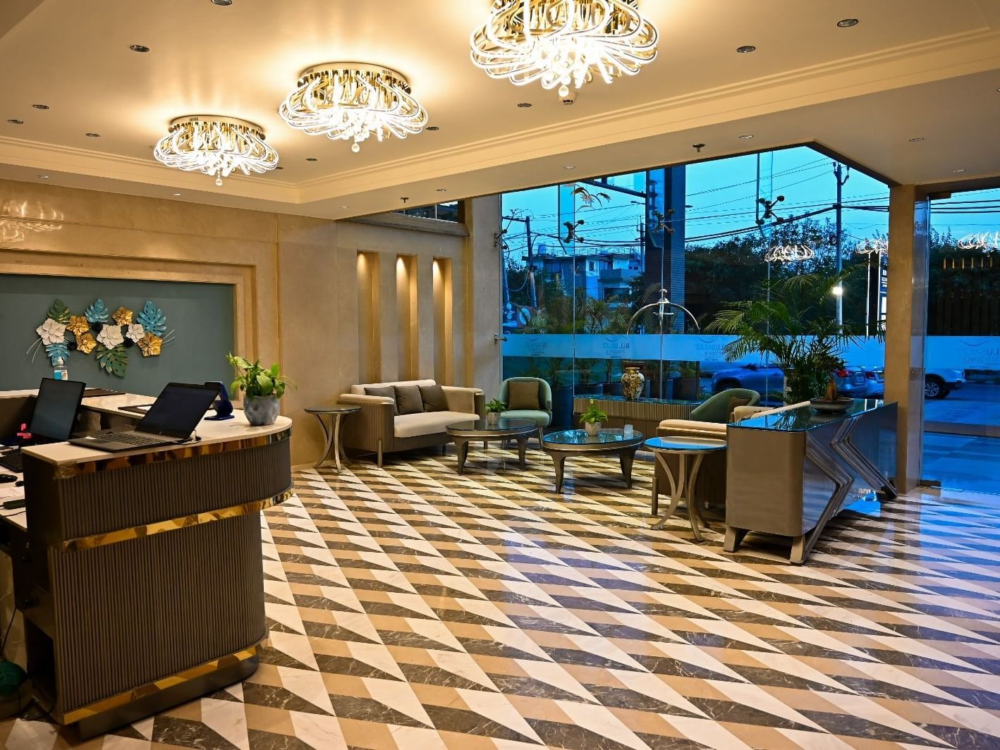 A spacious lobby featuring comfortable seating arrangements and a reception desk at 